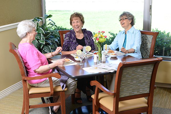 Three ladies enjoying breakfast together.